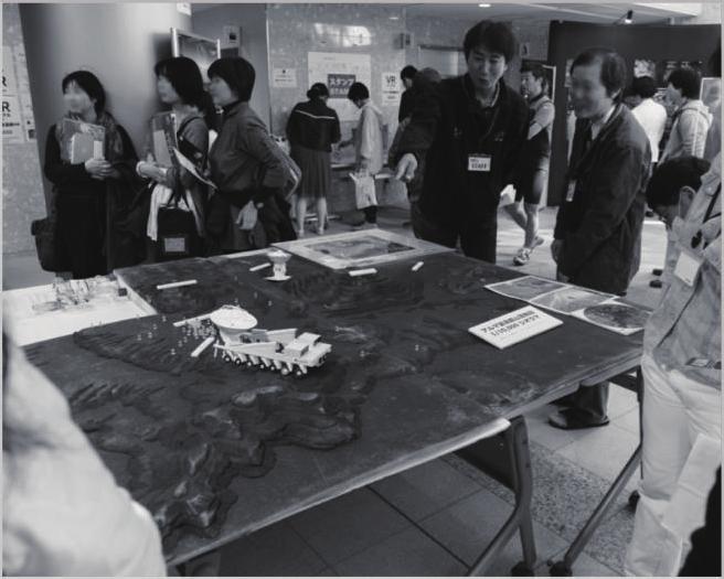 24 Fig. 5 A scientist explains a diorama of the ALMA observing site on the Mitaka Open House Day. database, and a useful system will be designed to share the database with other institutions.