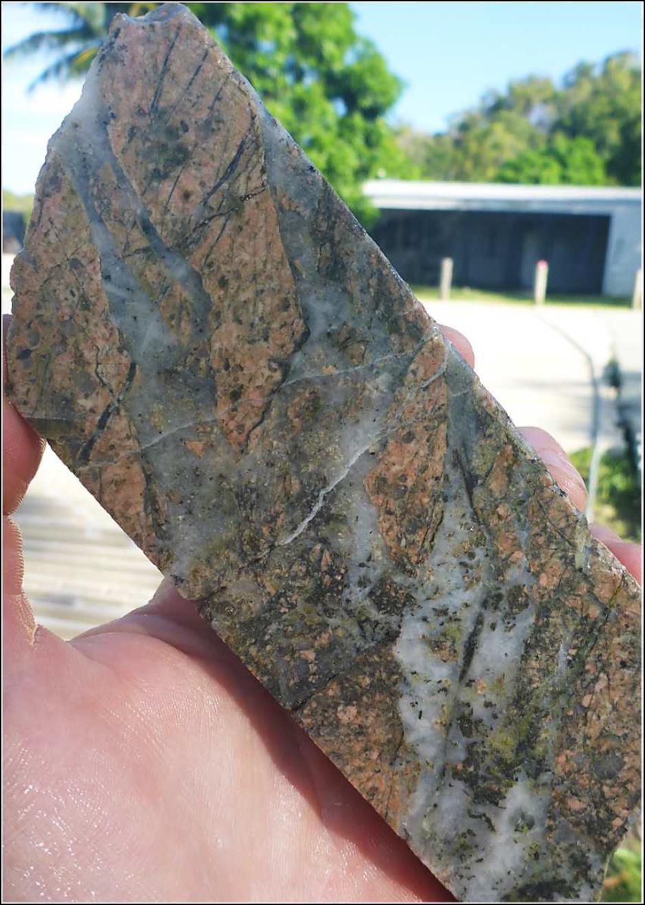 HORN ISLAND OLD MINE GEOLOGY Hand specimen showing tensional shattering of the brittle intrusive rocks with jigsaw fit breccia clasts cemented in place