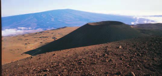 Shield cone Figure 18-12 Mauna Loa, shown in the distance, is a shield volcano in Hawaii. A small cinder-cone volcano on the flank of Mauna Kea is visible in the foreground.