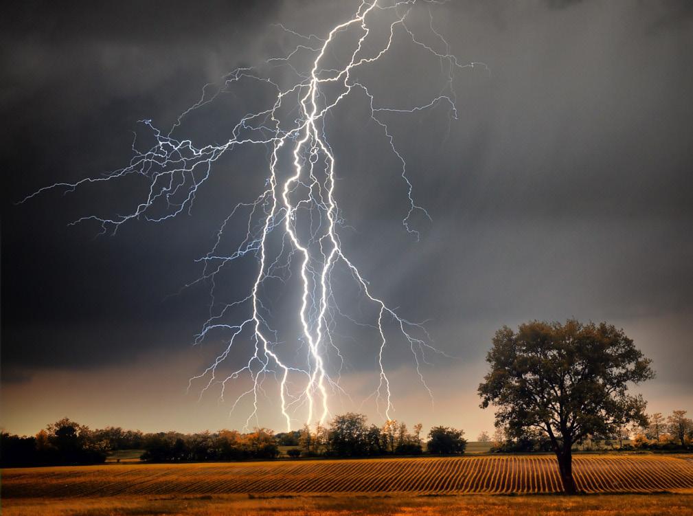 What is Lightning? Scientists know some facts about lightning. Lightning flashes happen because of atoms. Atoms are the tiny parts that make up all matter. The air is made up of atoms.