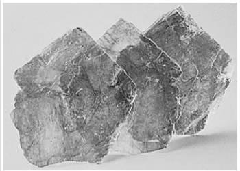 When minerals are permitted to grow without space restrictions, they will develop large uniformly-shaped objects and these large (visible) objects are called: 77.
