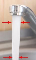 The speed of the water from a faucet increases as it falls because of gravity. The continuity equation tells us that the cross sectional area will decrease as the speed increases.