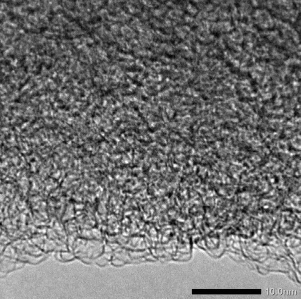 a b Figure 4. TEM images for activated carbons from mesophase pitch with a high and low content of mesophase a) DO100-3:1_800 ºC and b) DO10-3:1_800 ºC.