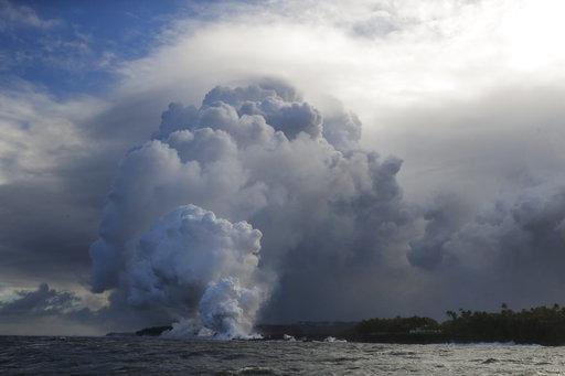 Sunday and flying lava causing the first major injury. (AP Photo/Jae C. A plume of steam rises as lava enters the ocean near Pahoa, Hawaii, Sunday, May 20, 2018.