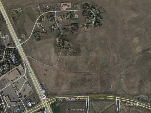 The site is bounded on the north by rural residential property, on the West by S. Parker Road, south by E. Cottonwood Drive, and east by a vacant land.