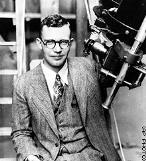 Pluto has a thin nitrogen atmosphere Clyde Tombaugh discovered that will refreeze onto the surface as Pluto in 1930 Pluto's orbit takes it farther from the Sun.