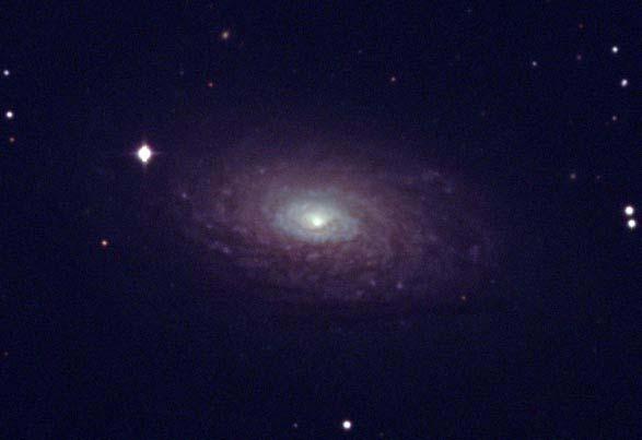 Since the spiral arms are loose and bulge relatively dim, this galaxy is classed as a Sc type spiral galaxy (Burnham, page 369).