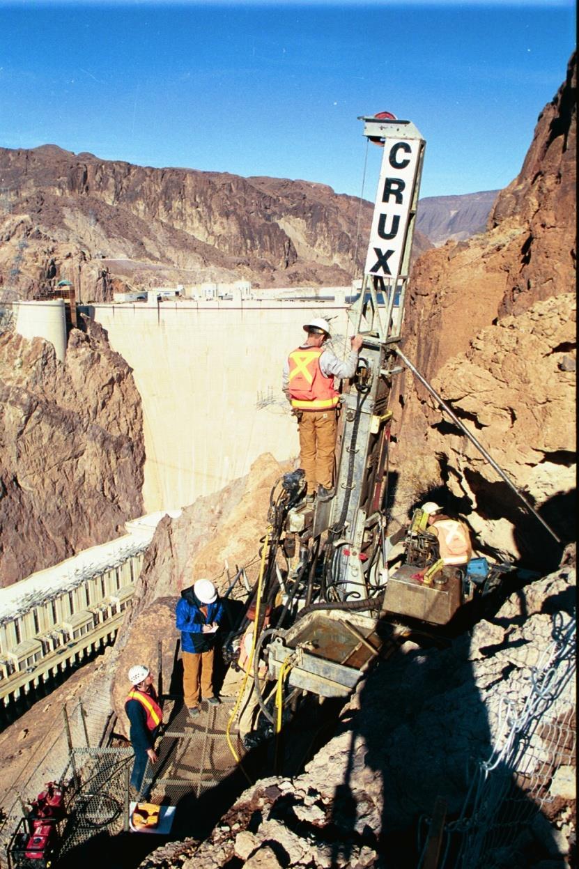 Canyon Wall Drilling Steep terrain with overhead power lines required portable rigs with access assisted by: Helicopter