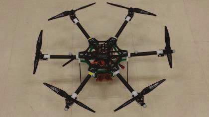 we describe a hexacopter and its characteristics. In Section III, the identification method is introduced and applied to identify the parameters of the hexacopter.