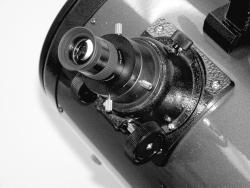 1.25" eyepiece adapter 2" eyepiece adapter Focus lock thumbscrew a. b. Focus knobs Figure 4. The 2" focuser of the Atlas 10 EQ.