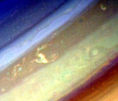 In False color, Saturn reveals banding like Jupiter Note that this banding is not easily seen from Earth through normal visible light The bands are generally broader near the equator (thicker) This