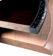 Edges are typically banded with a strip of solid wood to simulate solid wood construction, but below the veneer is particleboard.