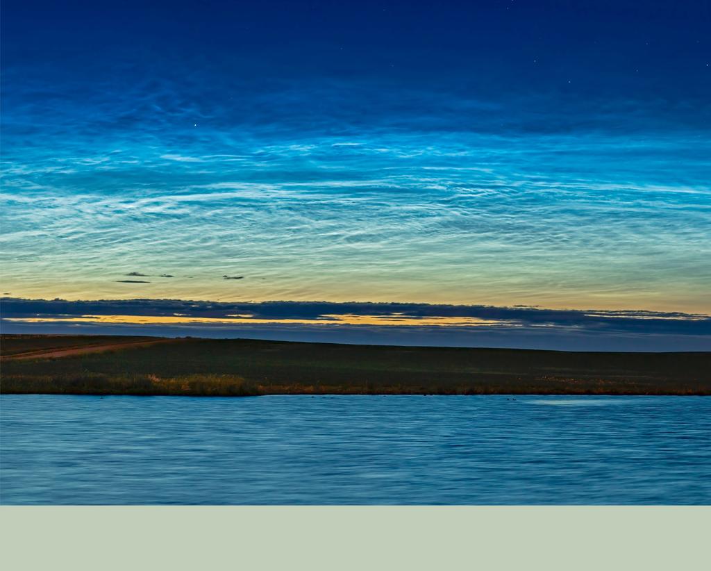 June brings noctilucent cloud season to the Canadian prairies when these waving bands of glowing clouds can be seen along the northern horizon during the