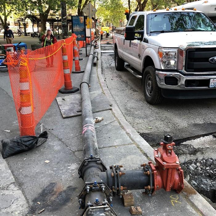 Installing the temporary water main on 1st Ave between Yesler Way and Cherry St. 1ST AVE S FROM YESLER WAY TO CHERRY ST Crews will continue potholing to confirm utility locations.