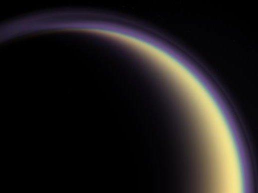 A composite image of Titan s atmosphere, created using Saturn s comet moon Phoebe. Credit: NASA/JPL blue, green and red spectral filters to create an enhancedcolor view.