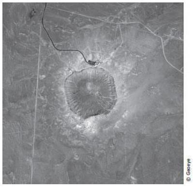 11. The satellite photograph below shows a large meteorite crater that is 1200 m in diameter and 170 m deep. This crater is located in a flat, arid part of north eastern Arizona.