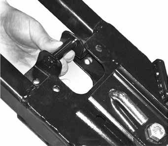 PLOW ASSEMBLY 12. Align manual latch (K) under top plate of A-frame as shown.
