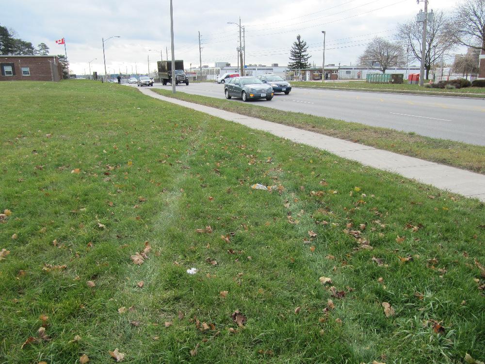 Southbound view showing tire marks of Porsche at point where it re-enters Highbury Ave at a point several hundred metres south of the intersection of Oxford.