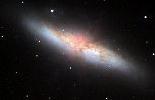 It is a disk of 50 billion solar masses, only a stone's throw (150,000 lightyears) from M82.