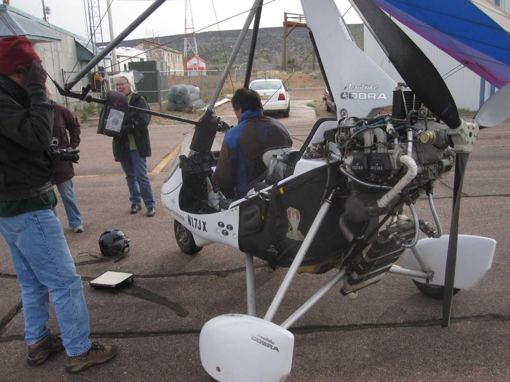 Right: The crew in Grants gathered around my trike as I entered coordinates of spots Larry wanted to overfly into my GPS.