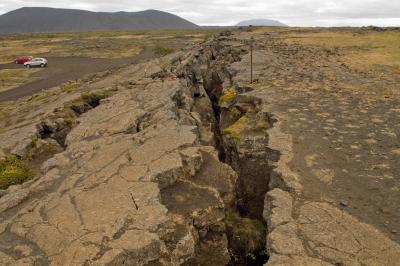 Fault line cracks scar the landscape at Grotagja Fault Iceland