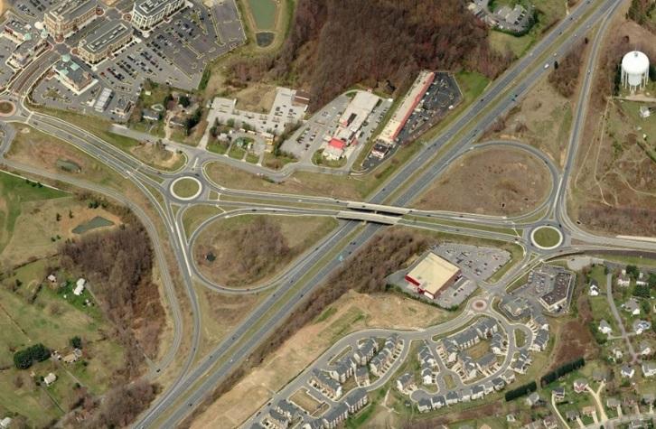 CHAPTER 6 DOUBLE ROUNDABOUT INTERCHANGE Overview A Double-Roundabout interchange provides continuous traffic flow of vehicles entering and exiting the main highway using separated grades for the main
