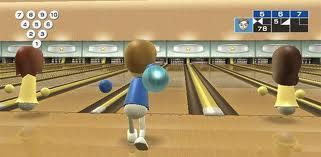 What is the mass of a bowling ball that travels at a rate of 5 m/s and