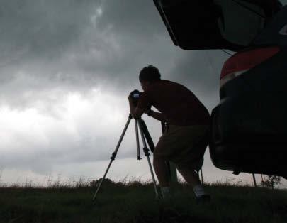 This storm chaser uses a video camera to record a storm so he can later study its movement. Staying Safe Storm chasers drive many miles across the United States in search of storms.