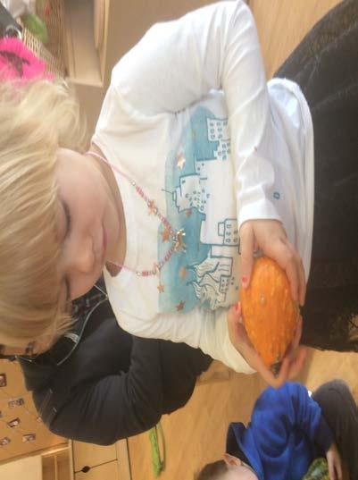 Zoe (age 3 1/2) exploring the orange gourd.