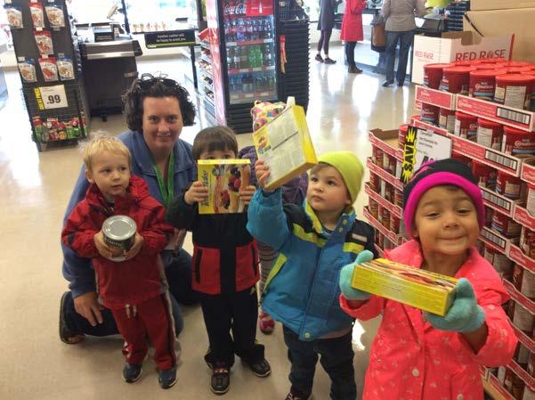 James (age 3), Sebastian W. (age 3 3/4), Eden (age 4), Carson (age 2 3/4) and Marianne, helping to carry the items.