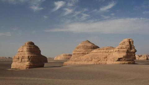 iii. Yardang: A yardang is an elongated ridge or remnant rock feature formed by wind erosion.