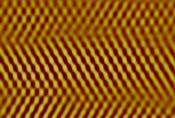 (b) and (c) AFM images of the boundary area within the red boxes of panel (a). The AFM images shows uniform moiré patterns distribution on the graphene domain.