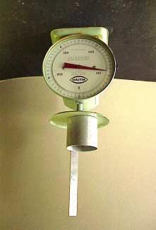 Figure 2. Snow coring tool and robust kitchen scale suitable for use in cold, wet field conditions.