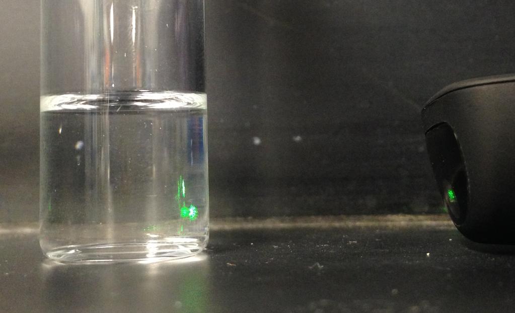 Fig. S4 Top) Green laser shining through 60 w/w% tba in