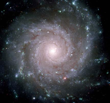 The energetic nuclear region is seen to glow in X-ray and gamma-ray light. M74: The Perfect Spiral.