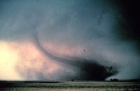 A tornado is a narrow, violently rotating column of air that extends from the base of a thunderstorm to the ground.