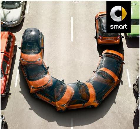 Q) A Smart car of 900 kg traveling at 1 m/s can barely make a tight circular turn of radius 5 m without skidding sideways. If the driver using the same car, tires and road wants to travel at 1.