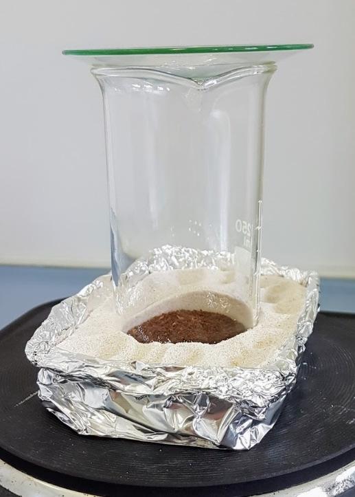Dryed ground coffee Sand Fig. 7: Sublimation of caffeine from coffee 2. 1. Roasted and ground coffee dessicated at 120 C 2. Sea sand, aluminium foil, beaker 250 ml, watch glass 1. Dessicate approx.