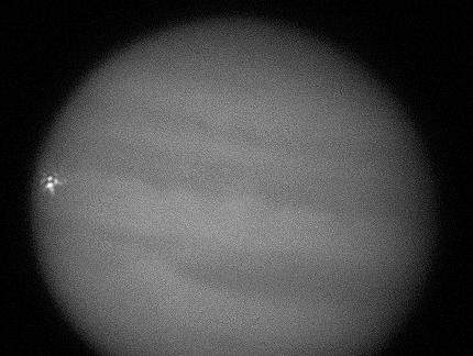 It looks like another asteroid (or comet) hit Jupiter. This photograph, taken on September 11 by a Dallas amateur astronomer shows the impact.