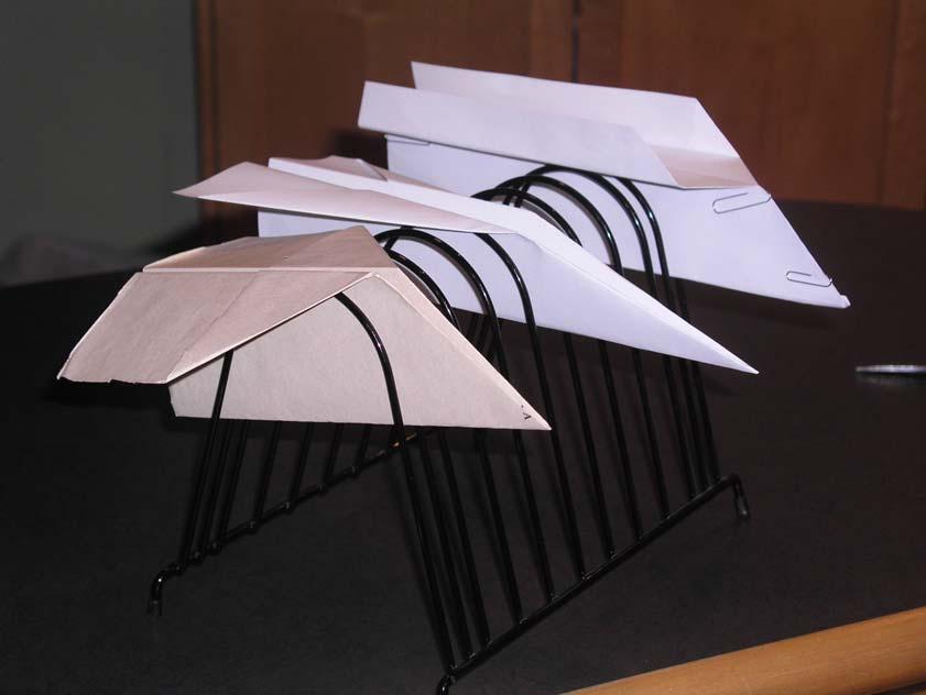 Figure 1: Aircraft prototypes. Left: Short and stubby, unweighted, heavy paper (i, j, k = 1, 2, 2). Middle: Sleek, unweighted, light paper (i, j, k = 3, 2, 1).
