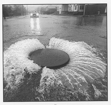 Flooded intersections may contain hidden hazards such as open manholes.
