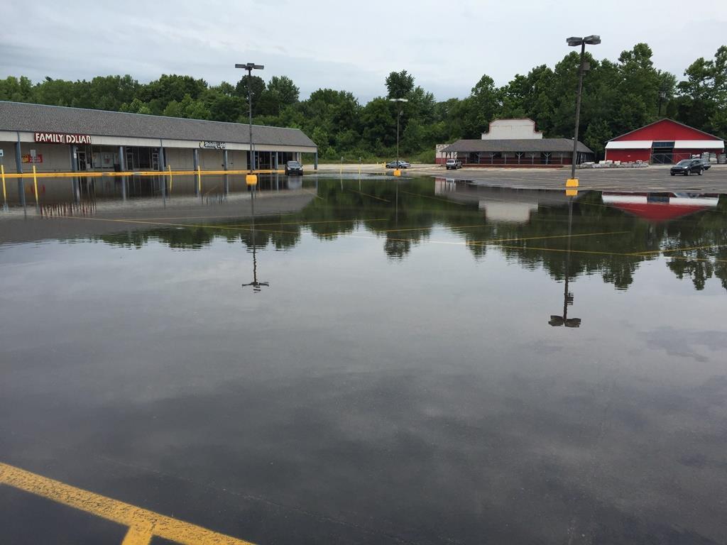Pictured above is the Village Shopping Center at Mooresville on the 18 th following more than 3 inches of rainfall in less than 3 hours. Photo credit is Chad Swain.