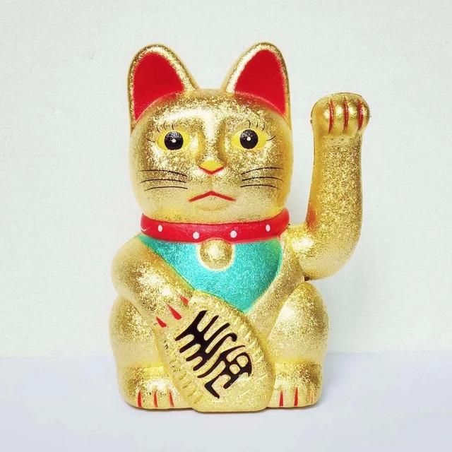 b) Another engineer from the marketing department wants to sell the component as a replacement for the well-known Maneki-neko ( ) (Figure 2), so he wants it to wave with a given frequency ω wave (0,