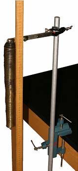 Set up your table clamp, rod, pendulum clamp, two-meter stick, and spring as shown in Figure #1. Be sure to attach the wider end of the spring to the pendulum clamp.