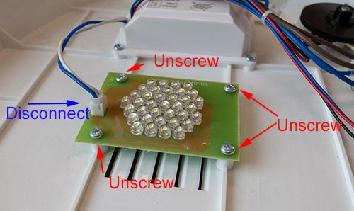 Be careful when separating the base, as some wires travel up the microscope and will still be connected. 6. Inside the base locate the bottom 36-LED board (shown below). 7.