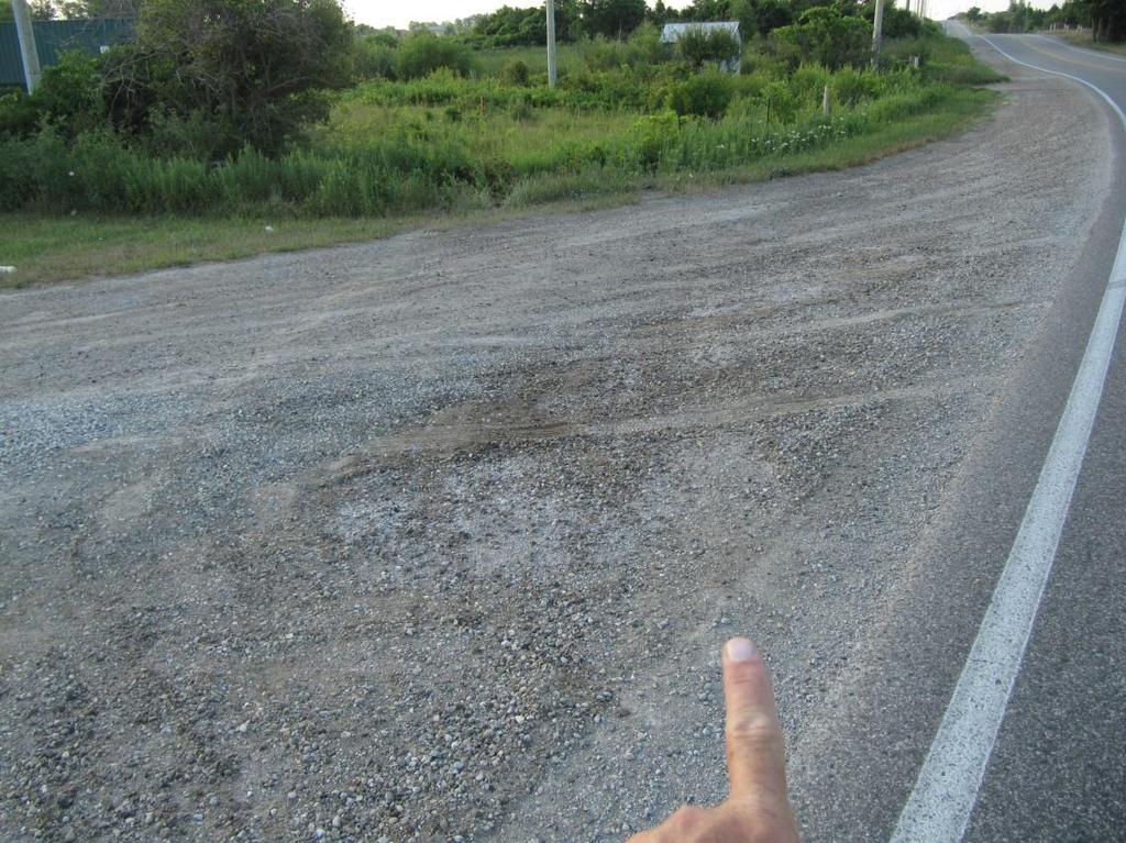 Figure 11: View, looking south, with the investigator's finger pointing to one of the tire marks