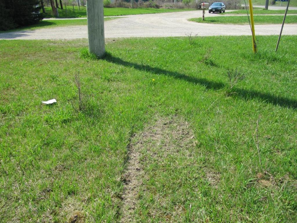 Figure 19: Looking past the utility pole, the vehicle travelled over a long length of gravel.