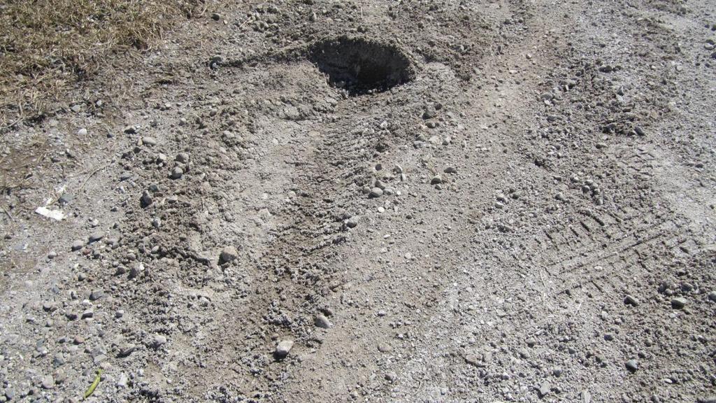 Figure 36: A close up view of one of the ends of the tire marks shows how the sliding tire comes a halt a the mound of earth and then there is a tire print progressing to the left where the rolling