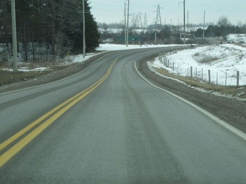 Figure 2: View of the north curve of the S-curve, looking south, on March 6, 2013. Figure 3 shows a driver s view as a southbound vehicle approaches the upslope at the north (right) curve.