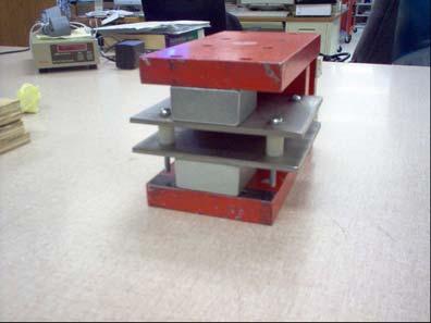The permanent dipole magnet was constructed from two 5.08x5x08x2.54 cm 3 blocks of Neodymium Iron Boron (NdFeB) encased within an iron support frame.